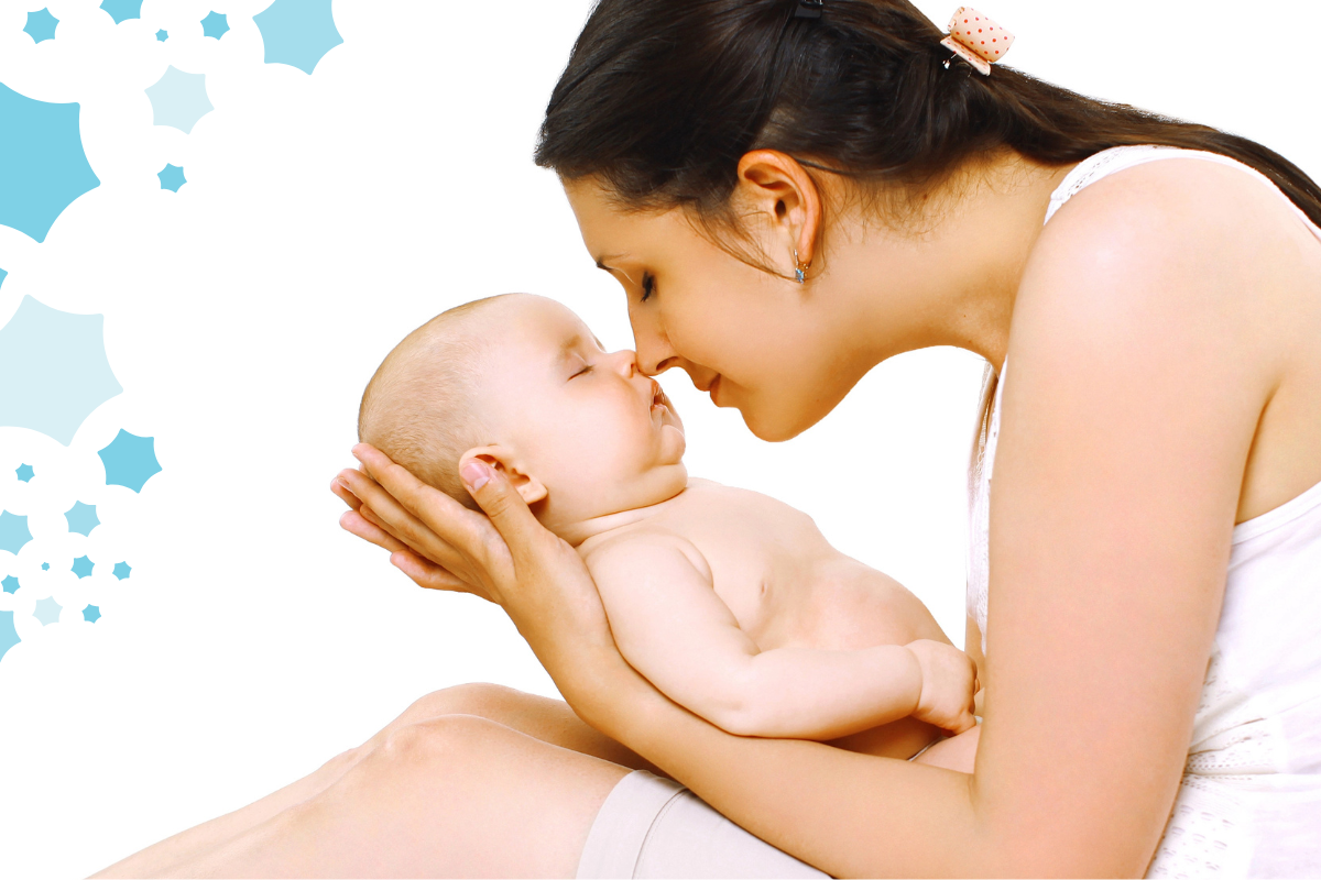 A mother and her baby, their noses touching as they share a sweet moment. She's cuddling at her little one with warmth, while the baby, eyes closed, rests peacefully in her hands. A tender, intimate connection between mom and child.